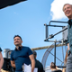 three men smiling off camera
